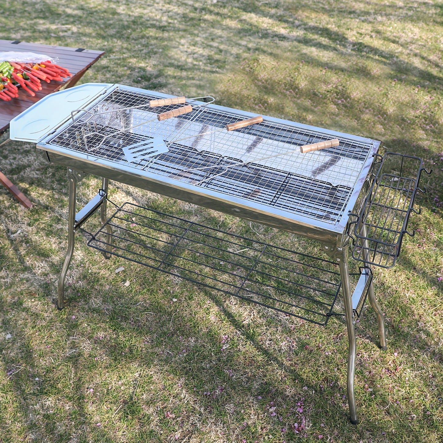 Portable Stainless Steel Folding Barbecue Grill With Tool Set Including Forks Shovels And Tongs Large Charcoal Grill With Side Tables And Condiment Storage Basket Ideal For Outdoor Cooking