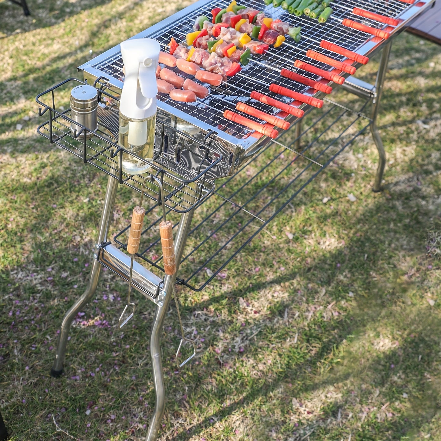 Portable Stainless Steel Folding Barbecue Grill With Tool Set Including Forks Shovels And Tongs Large Charcoal Grill With Side Tables And Condiment Storage Basket Ideal For Outdoor Cooking